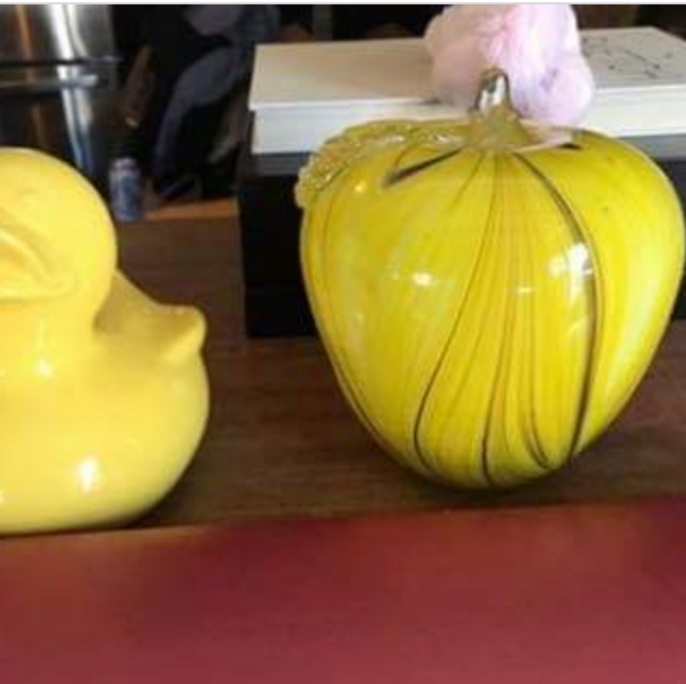 Hollow ceramic duck and solid glass apple